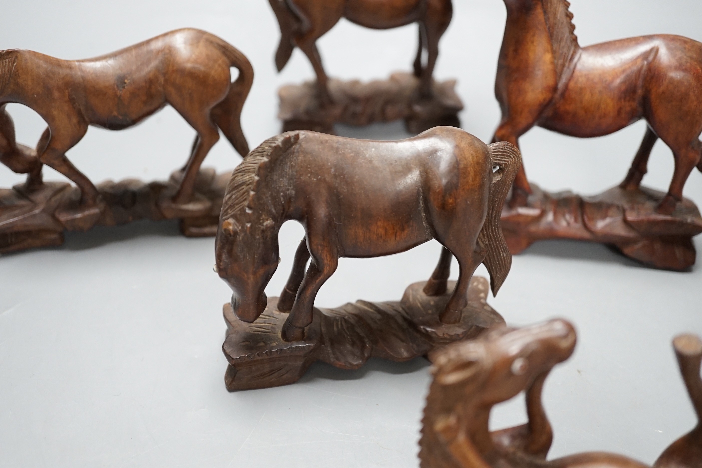 Seven Chinese hardwood models of horses. Tallest 13cm